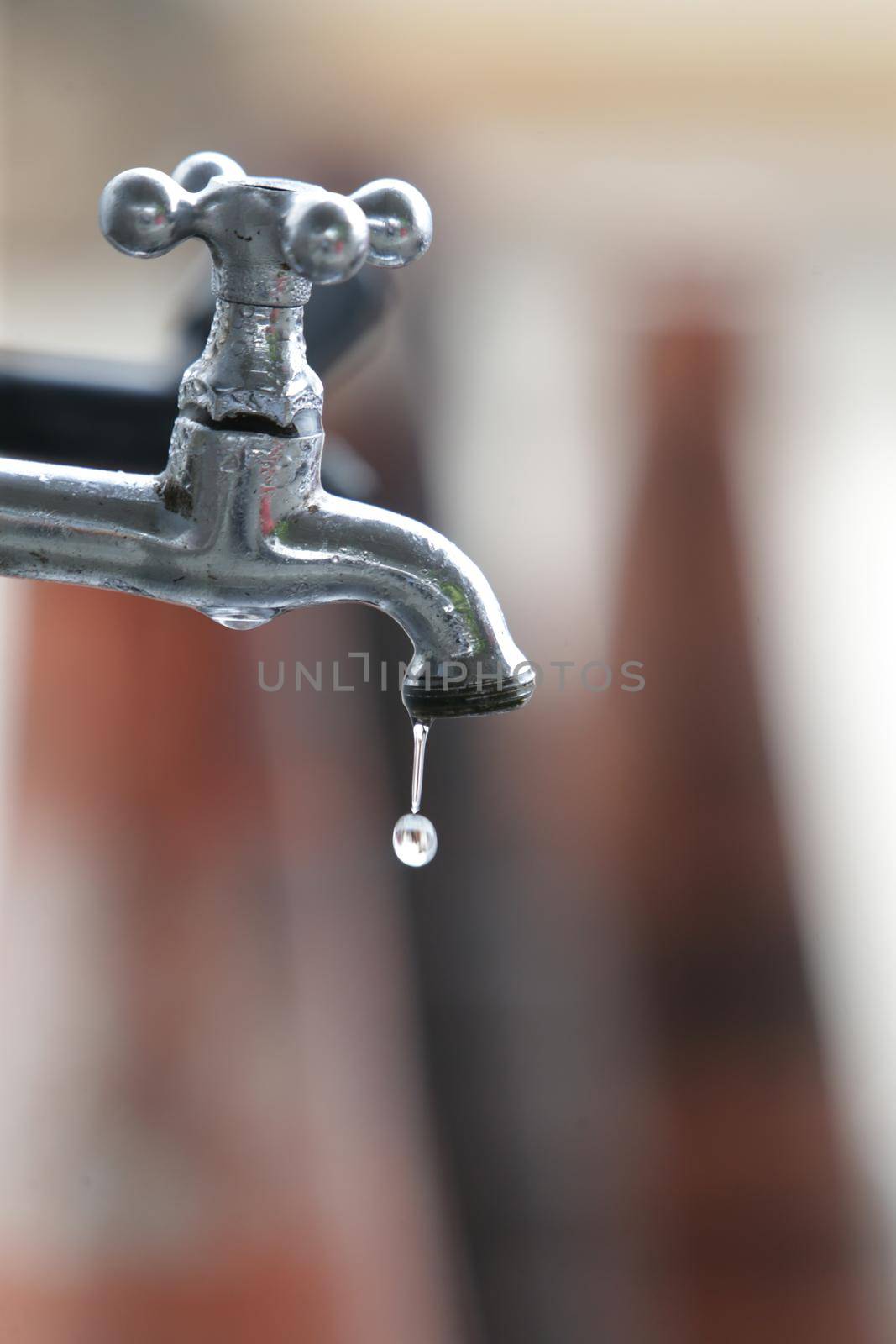 feira de santana, bahia, brazil - june 10, 2022: drop of water dripping on a tap of a gas station in the city of Feira de Santana.