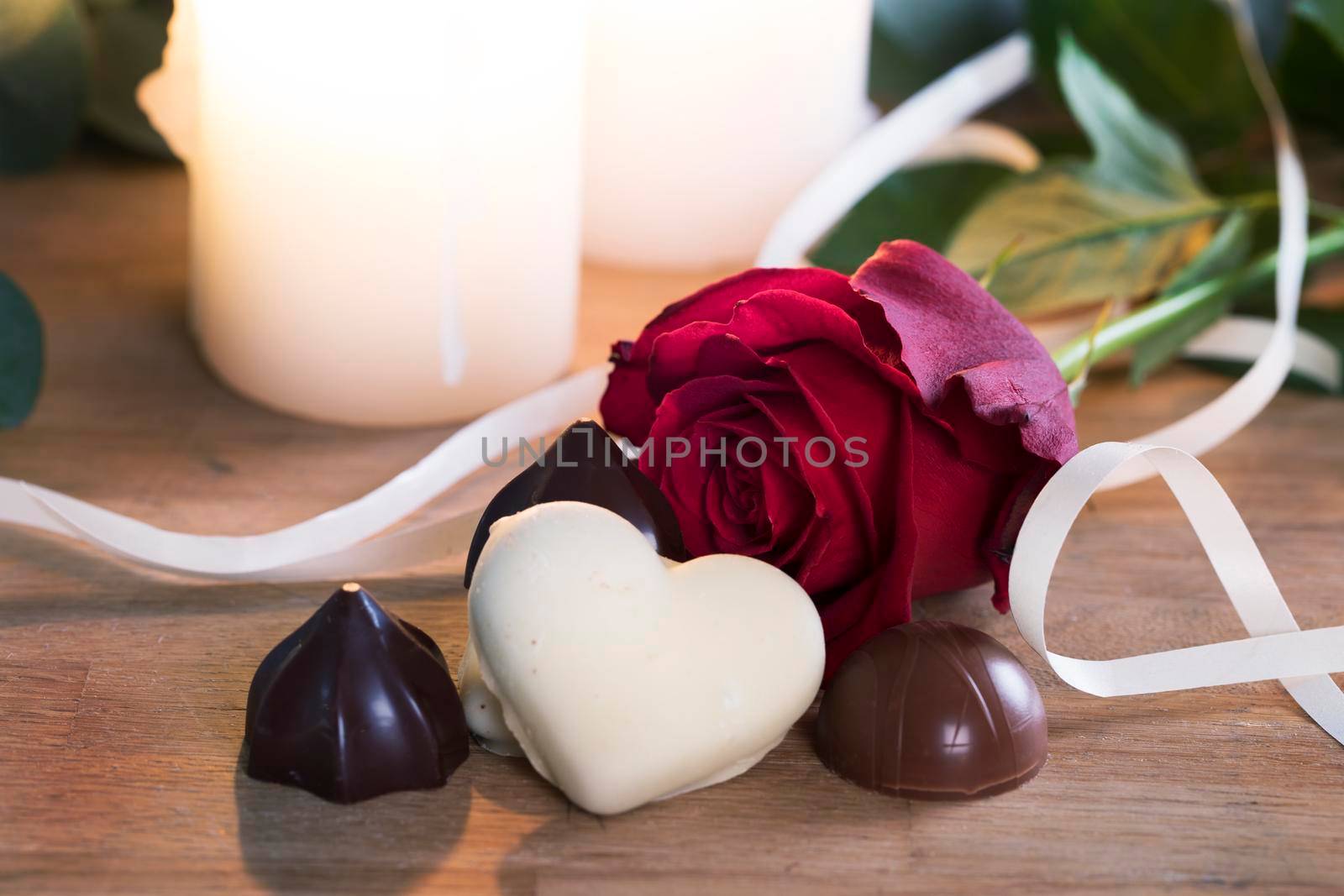 Chocolates and a red rose for your valentine.