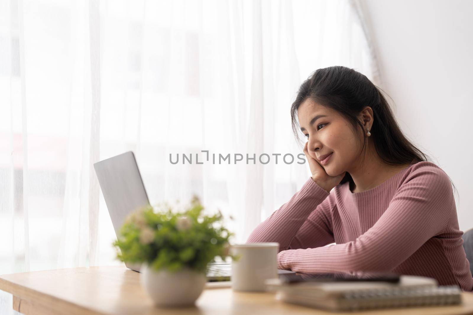 Asian woman working laptop. Business woman busy working on laptop computer at cafe