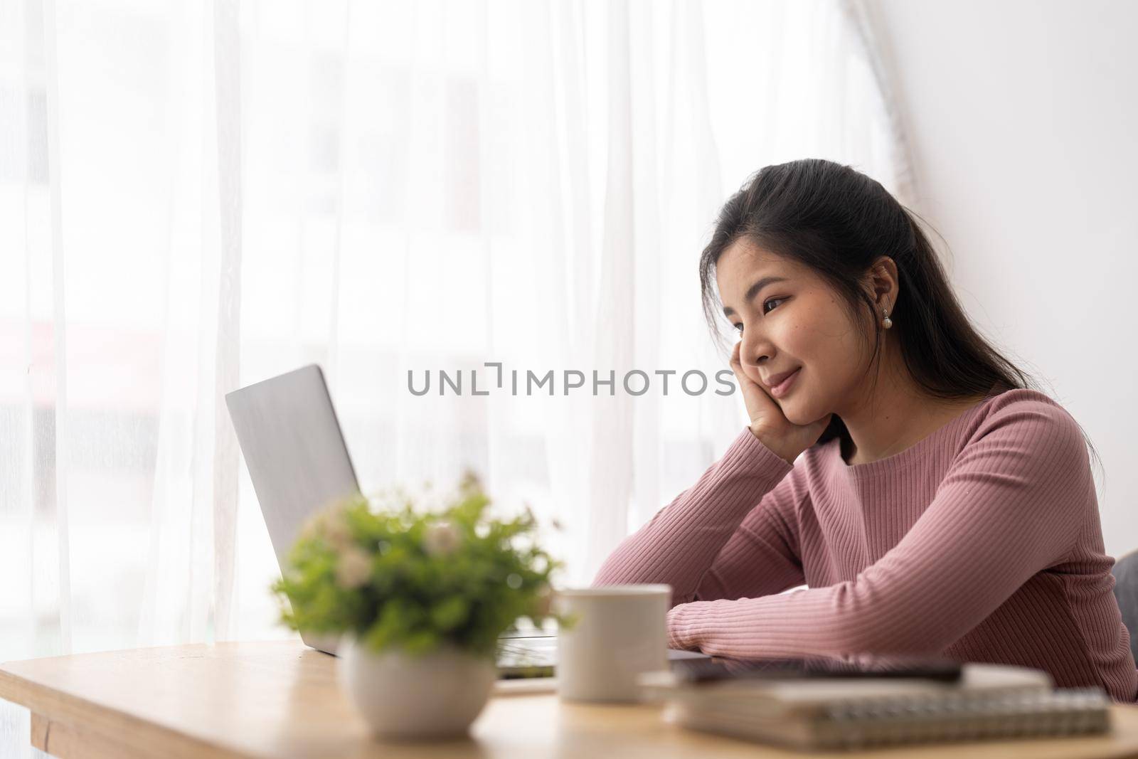 Asian woman working laptop. Business woman busy working on laptop computer at cafe. by nateemee