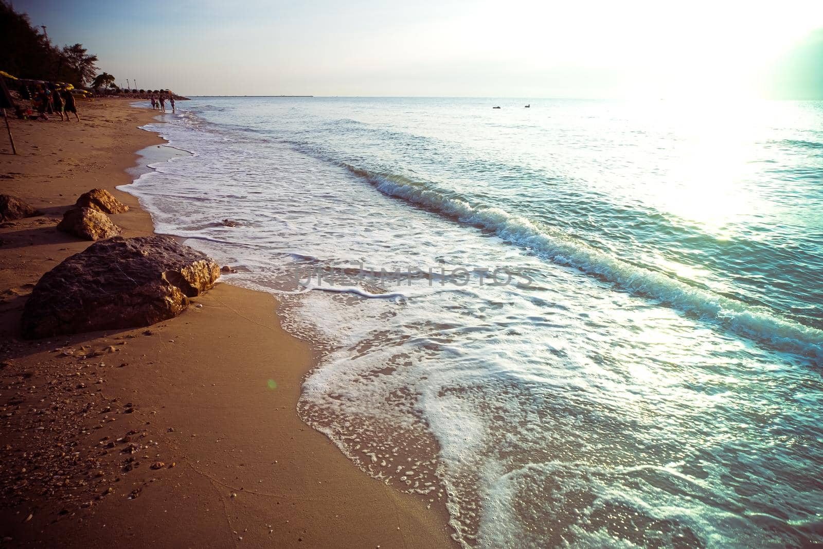 Soft Blue Waves on the beach at the summer time. sea beach blue sky sand sun daylight relaxation landscape viewpoint. The color of the water and beautifully bright clear water. by Petrichor