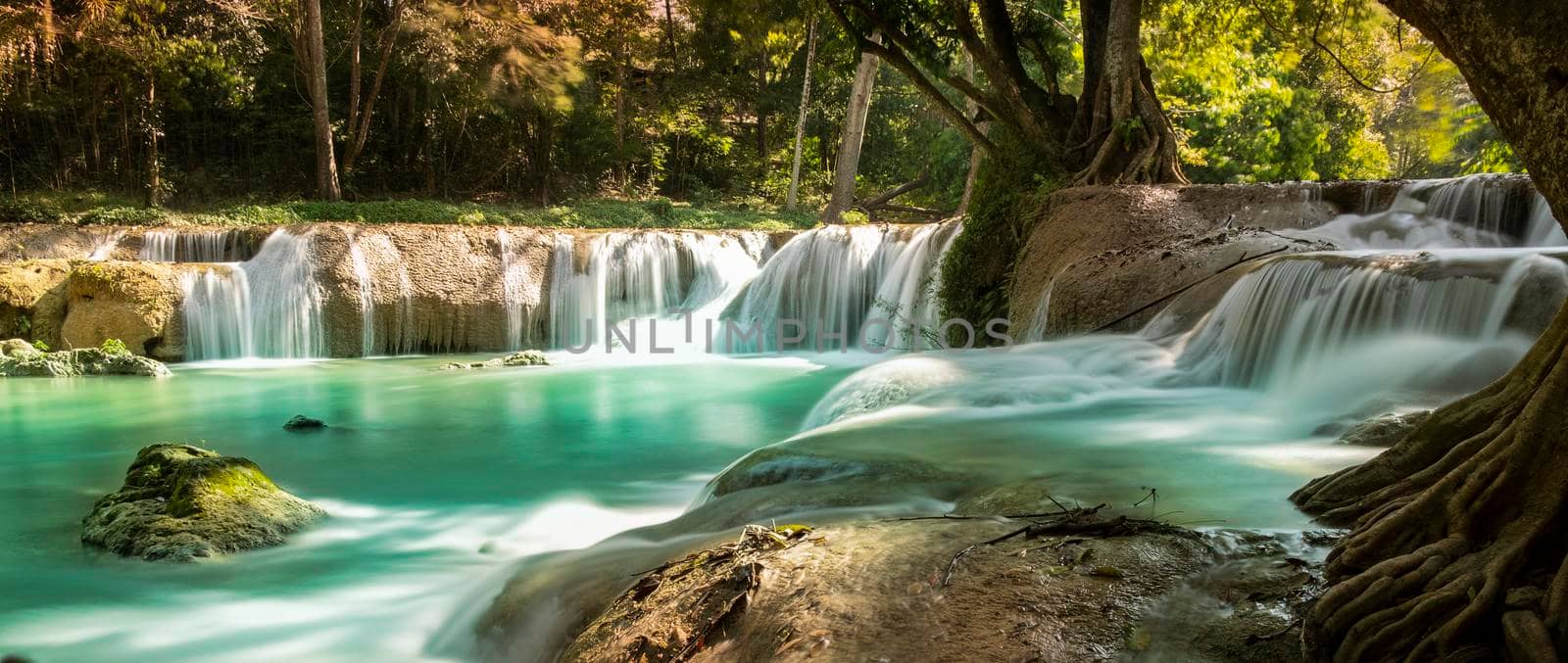 Panoramic exotic  beautiful tropical deep rainforest waterfall  and lake panorama landscape