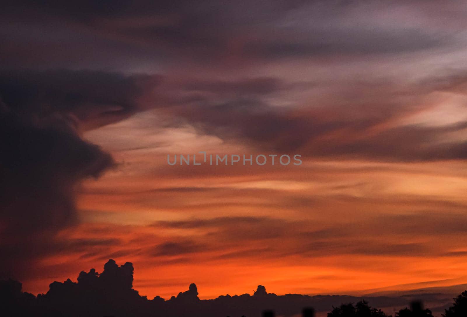 Giant dark cloud. Storm Clouds at Sunset abstract weather season.