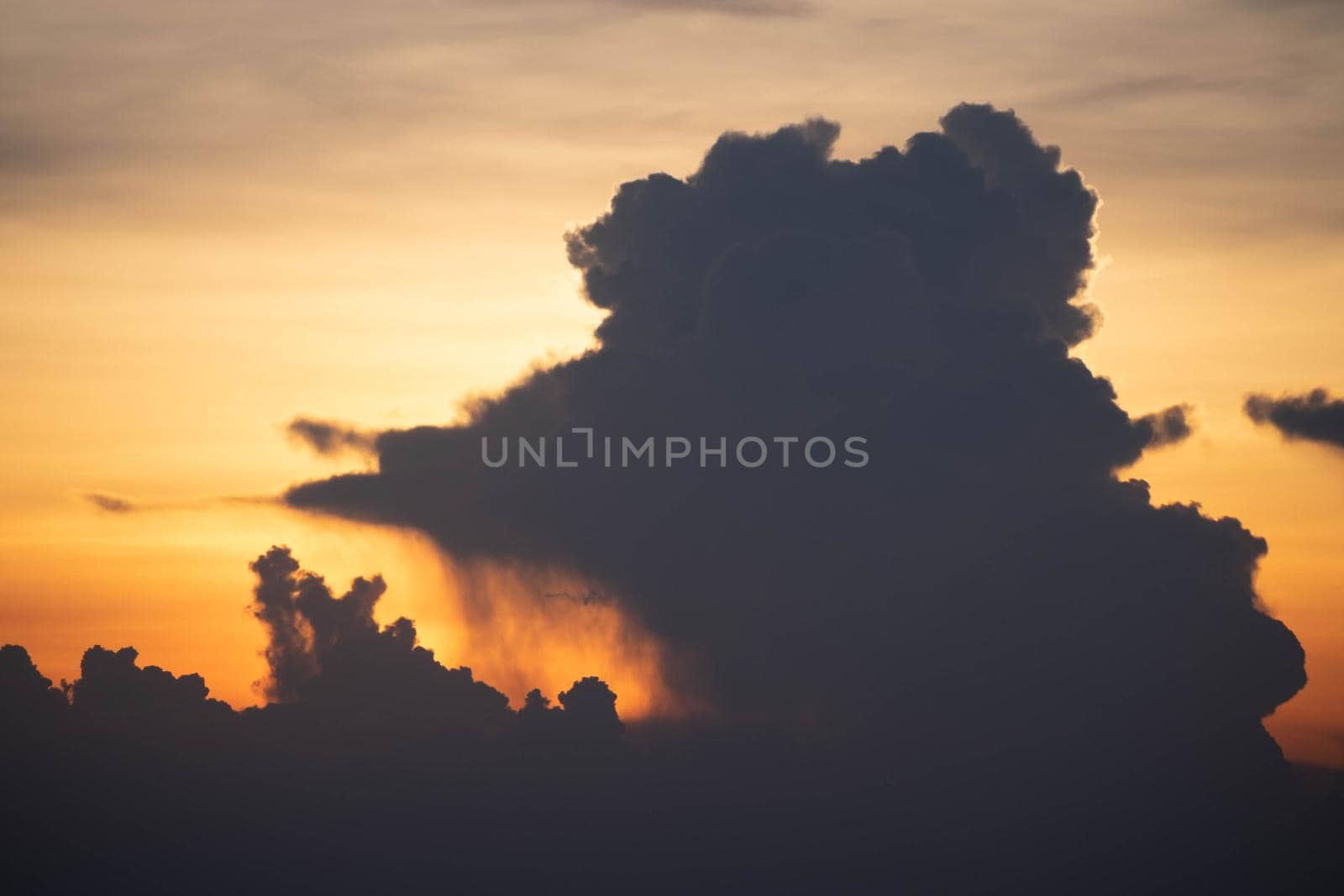 Giant dark cloud. Storm Clouds at Sunset before rain abstract weather environment season. by Petrichor