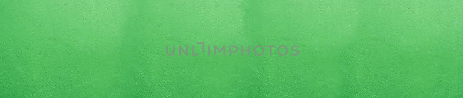 Panoramic Wide angle Vintage textured stucco wall background. green stucco wall. Background of a green stucco coated and painted exterior, rough cast of cement and. Abstract  wall grunge stone.
