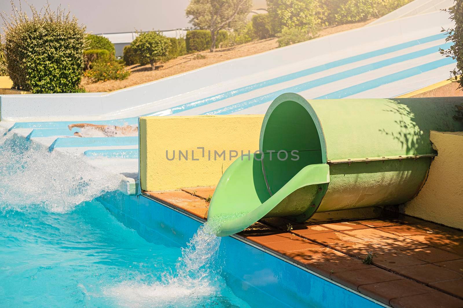 Water park, bright slides with a pool. A water park on a summer day.