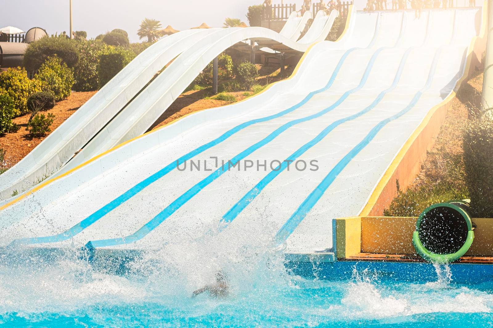 Water park, bright slides with a pool. A water park on a summer day.