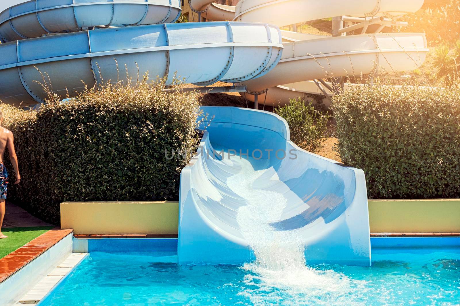 Water park, bright slides with a pool. A water park on a summer day.