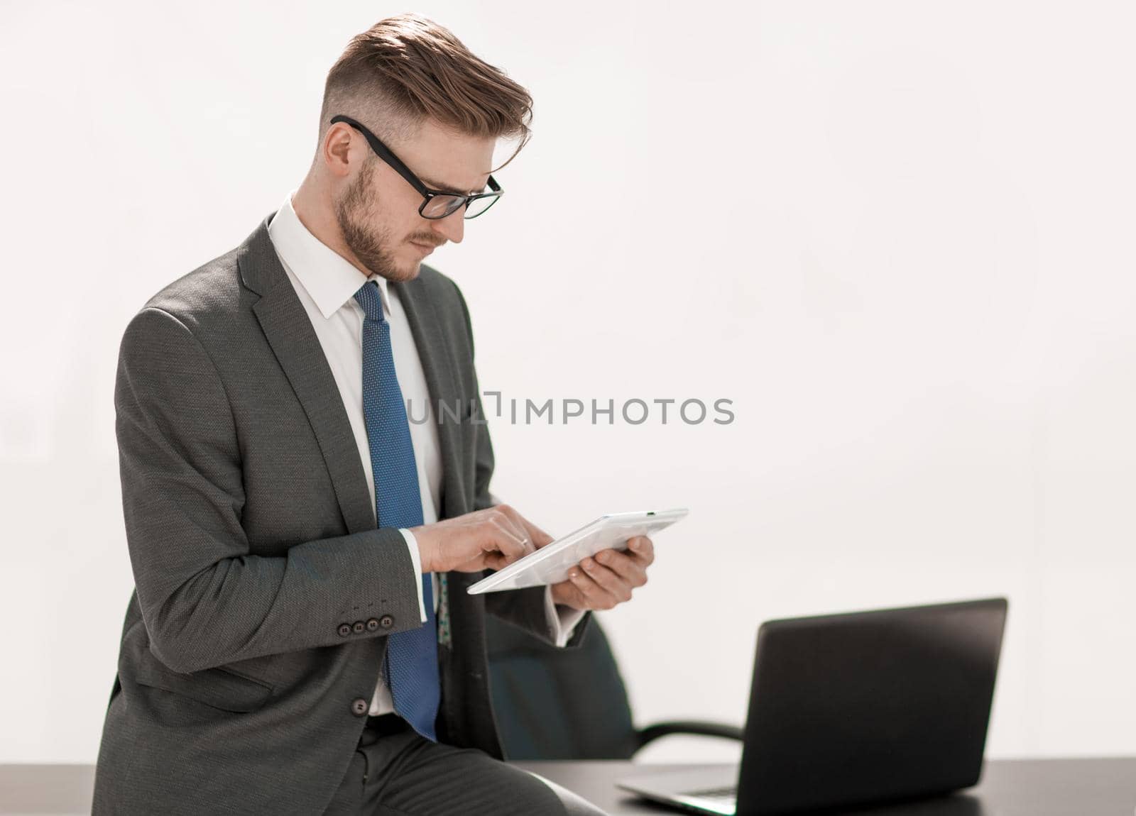 responsible businessman using digital tablet by asdf