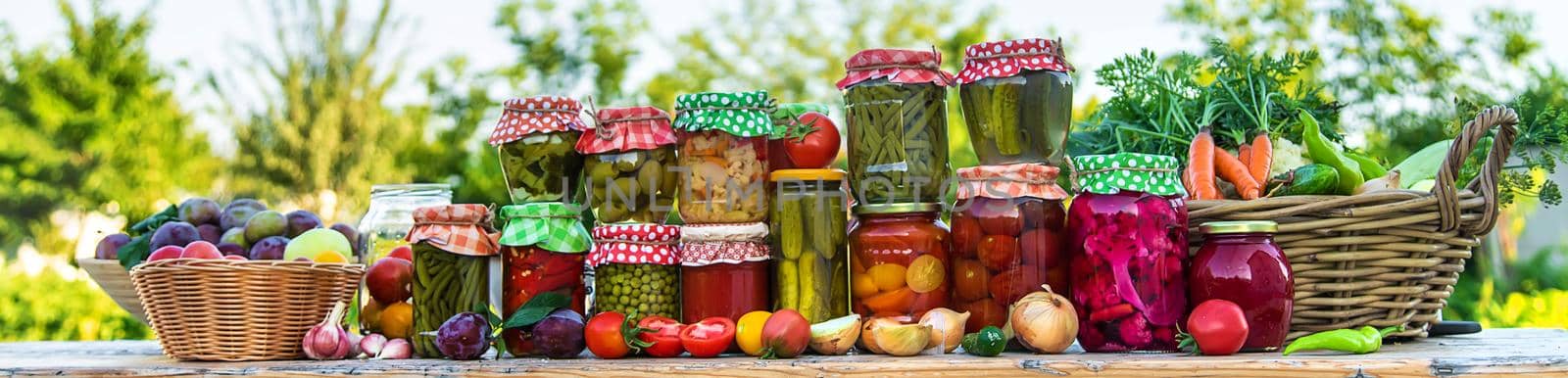 Jars with preserved vegetables for the winter. Selective focus. by yanadjana