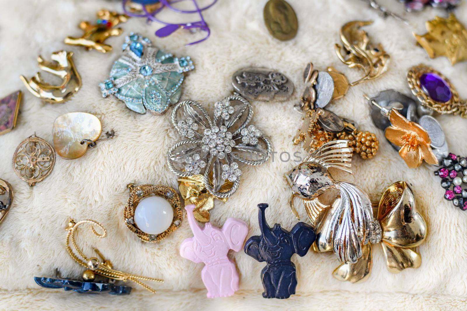 DIEPPE, FRANCE - NOVEMBER 17, 2019: Vintage brooches sold at the flea market in France