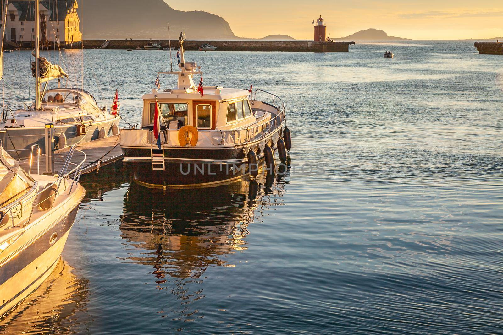 Alesund Sea port harbor with ships at peaceful dawn, Norway, Scandinavia