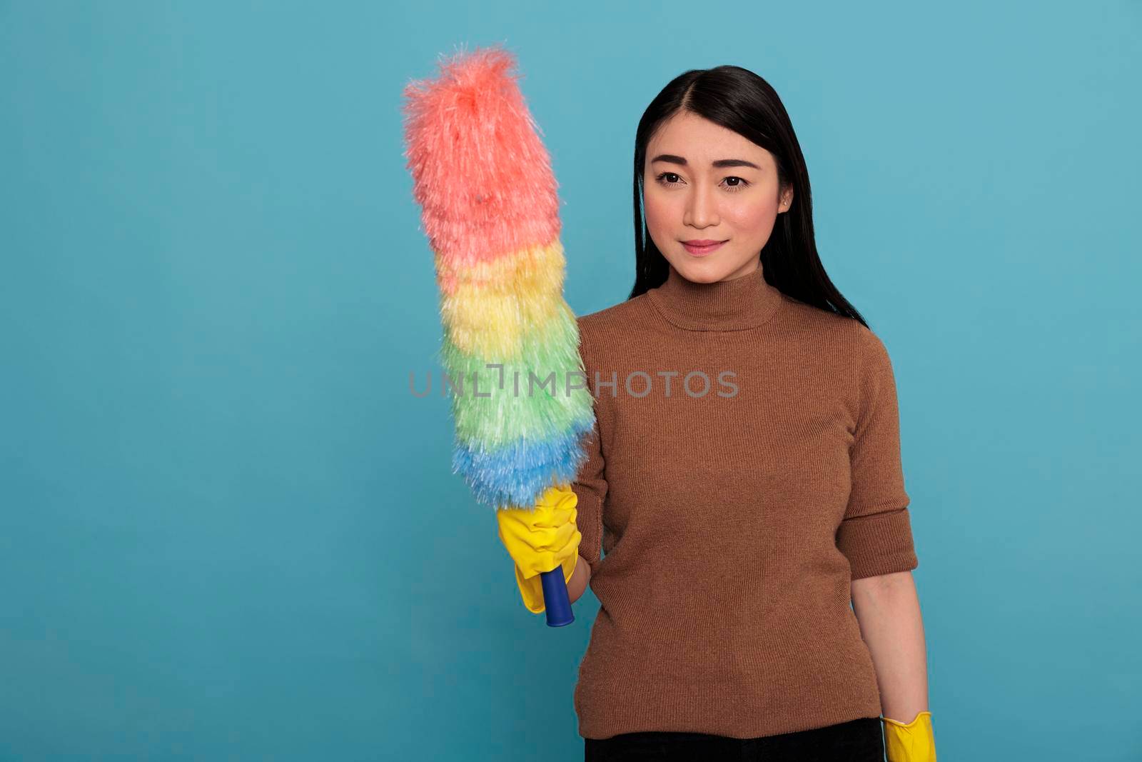 Delighted pleased asian housemaid from homework by DCStudio