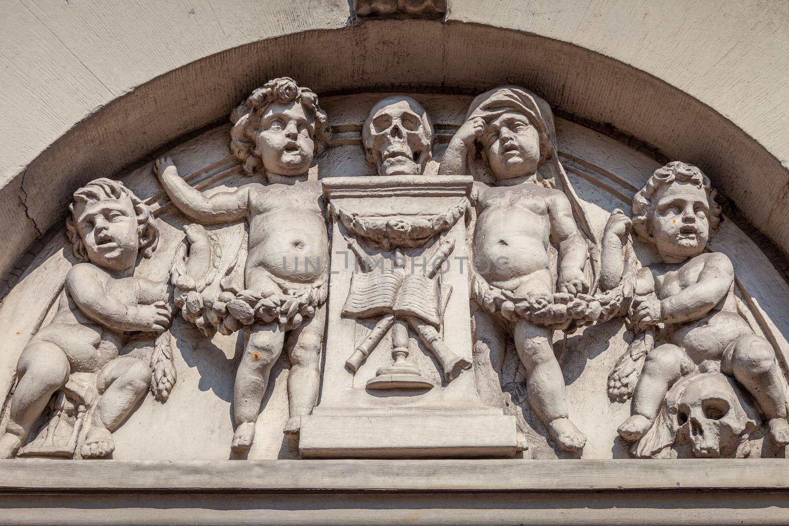 Amsterdam ancient mural with skulls and cherubs, dutch architecture, Netherlands