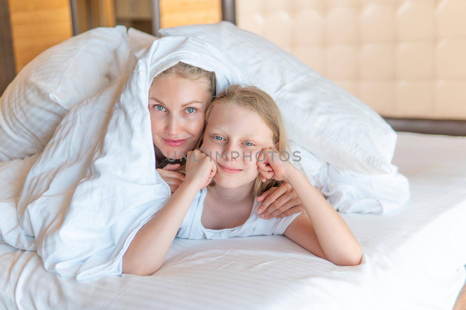 Blanket family over glad daughter woman bed head girl beautiful, from lying morning for caucasian and person calm, attractive bedtime. Healthy relaxation serene,