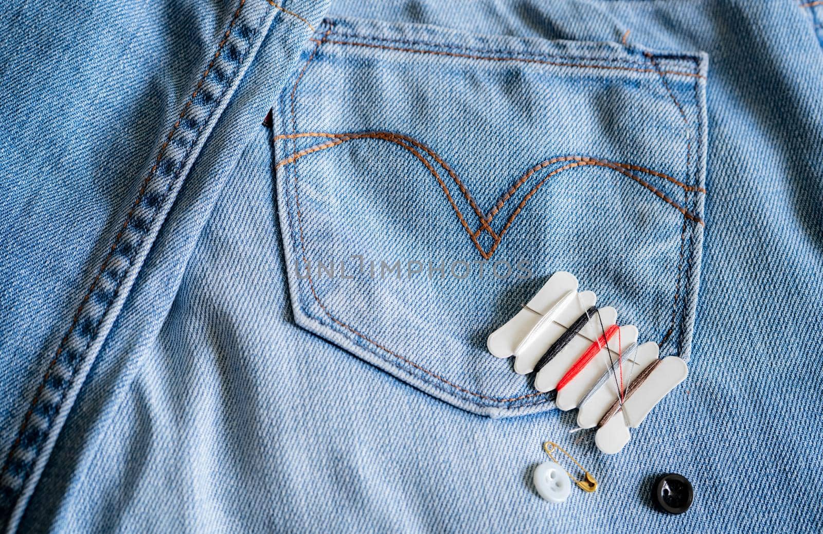 Hotel sewing kit on jeans. Small portable thread repair emergency kit with needles, buttons, threads, and safety pins for hotel, home, and travel. Eco sewing kit. Hotel amenities. Clothing repair kit. by Fahroni