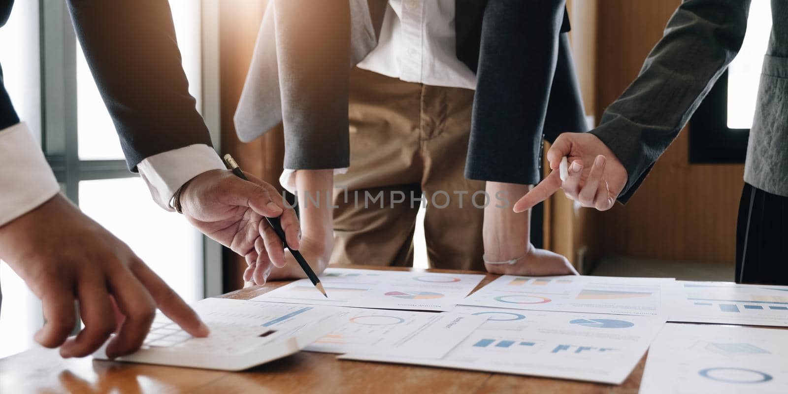 Business adviser analyzing financial figures denoting the progress in the work of the company by wichayada