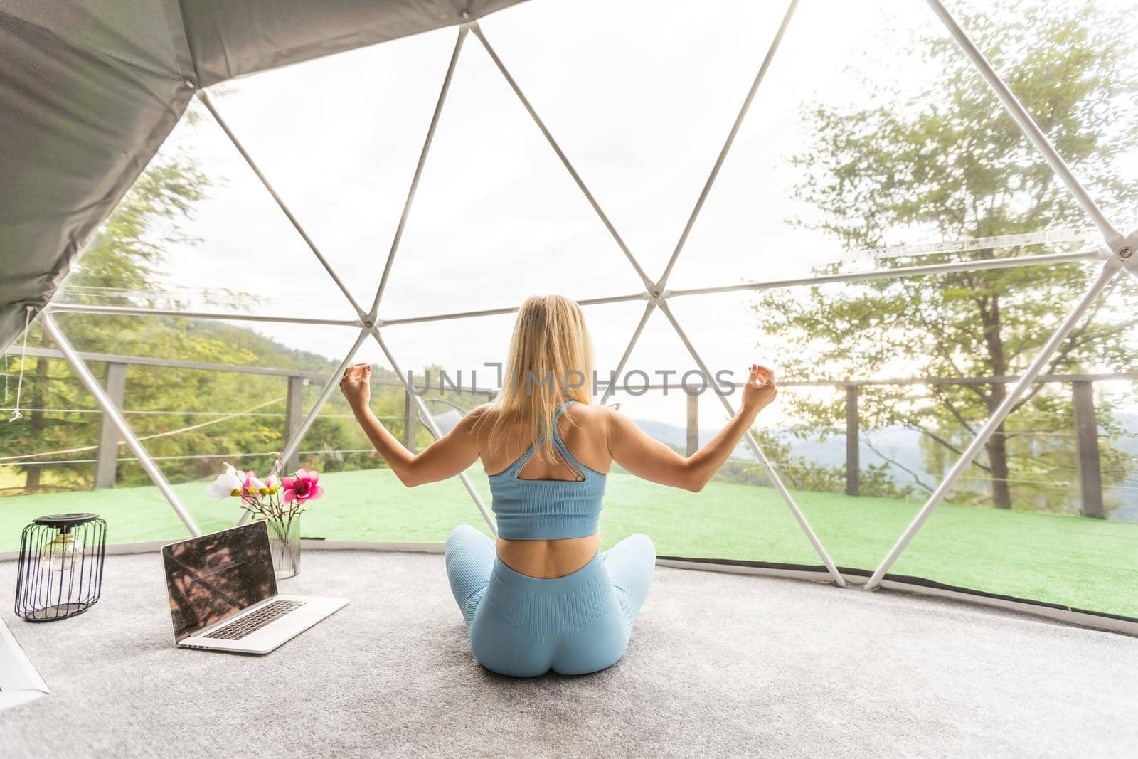 Pretty girl in glamping tent, snow mountains on background