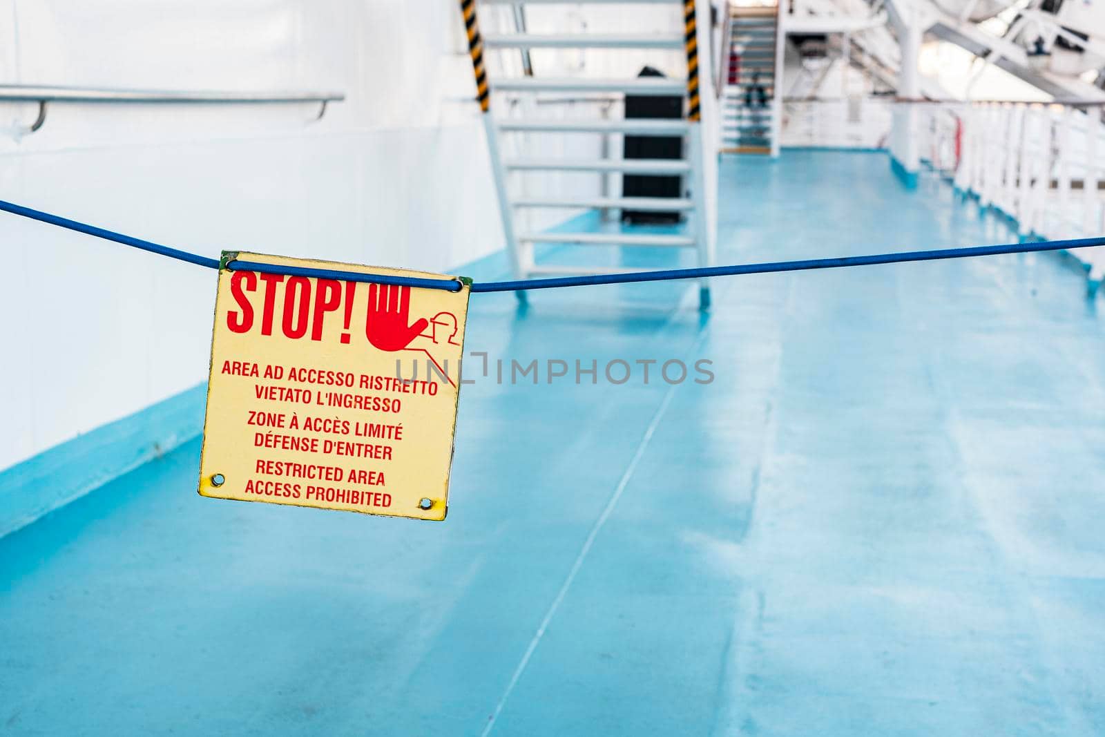 stop sign on walking deck on the ship at sea. Italy