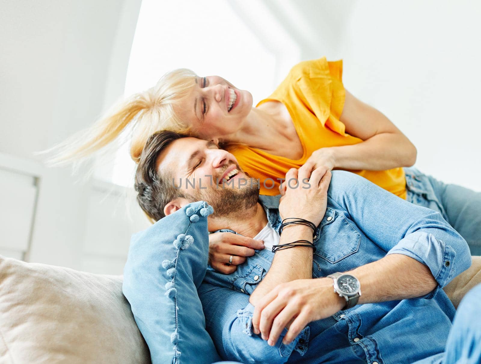 Portrait of a lovely young couple together at home