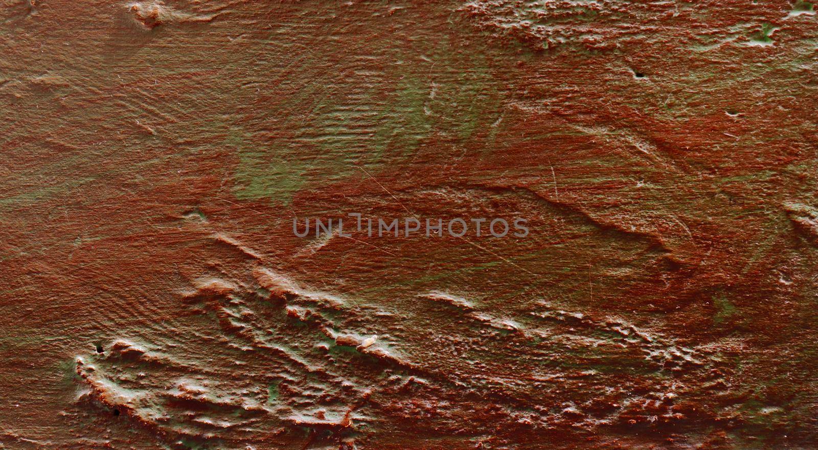 Texture from a metal surface with old red paint.