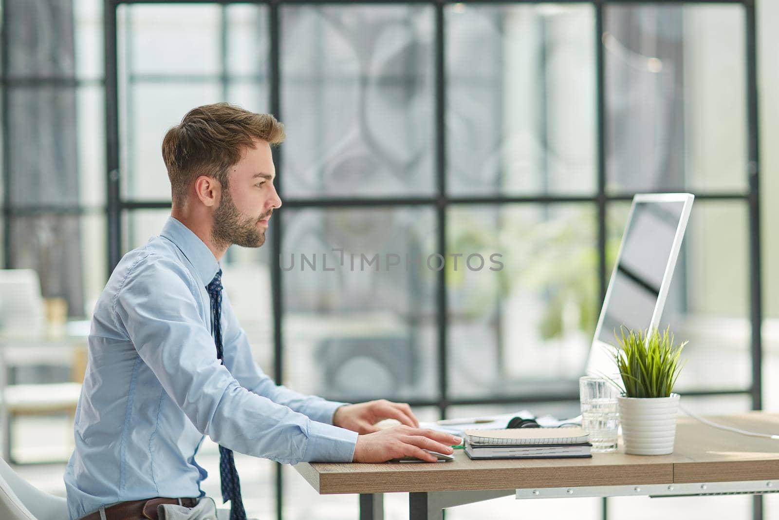 Young businessman working at office
