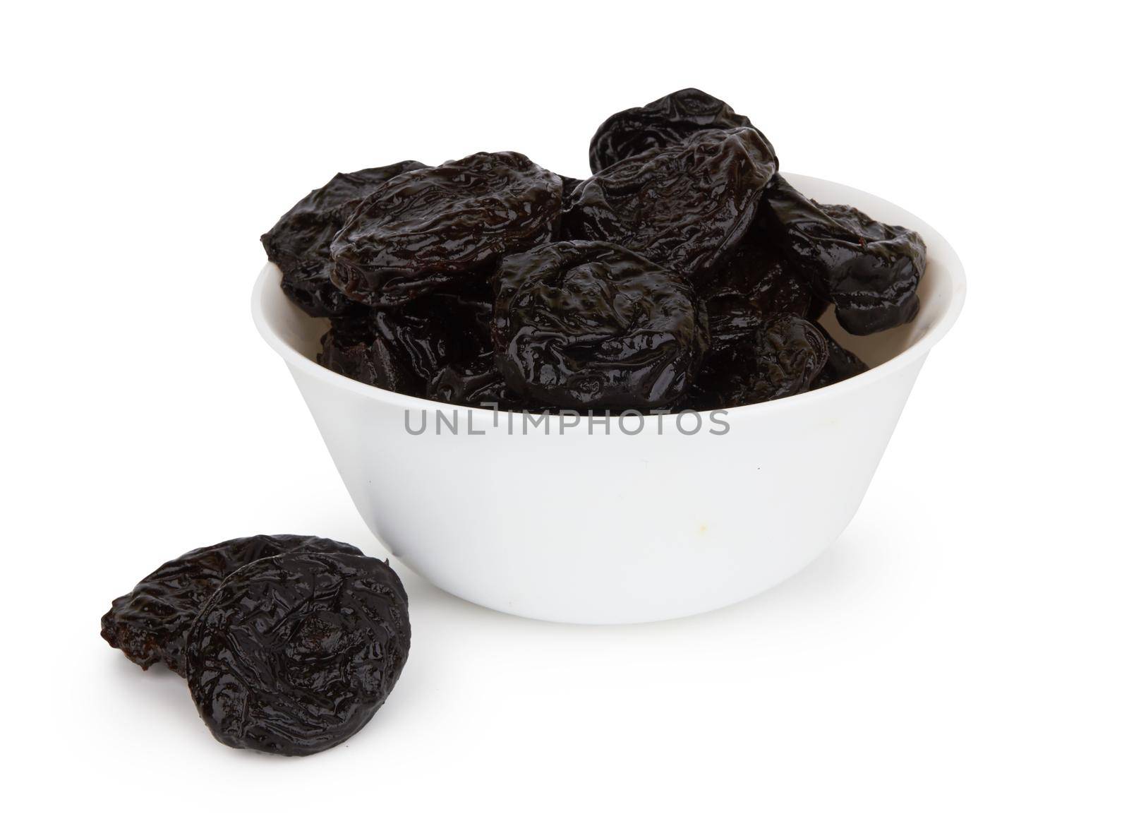 Heap of prunes isolated on white background