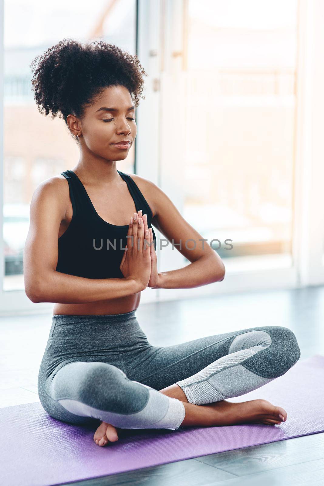 Yoga is the best exercise there is. a beautiful young woman practising yoga in a studio