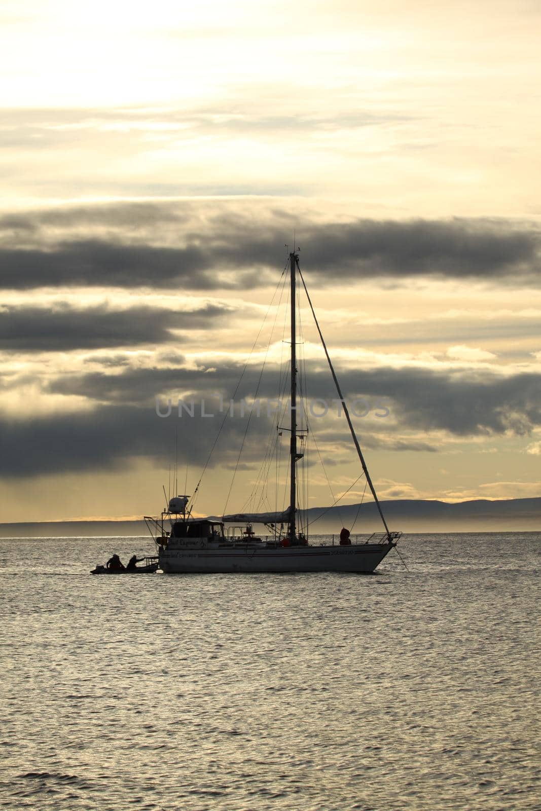 A sailboat anchored near Pond Inlet, Nunavut waiting for weather to transit through the Northwest Passage, Canada