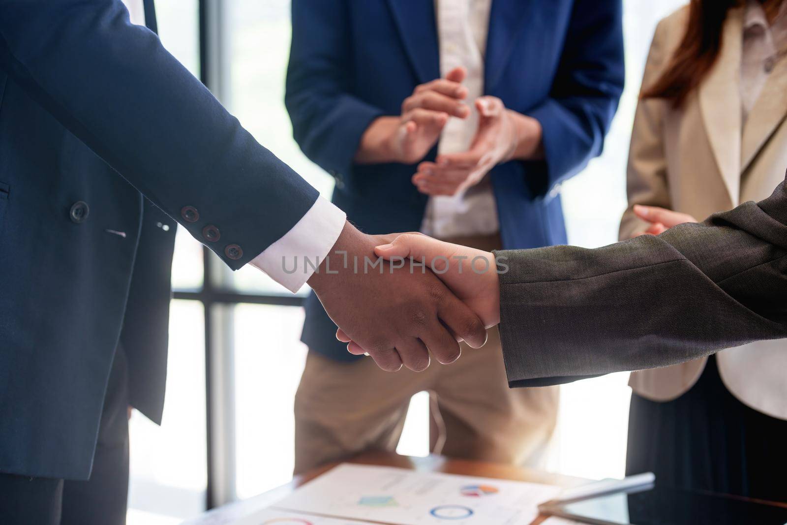 businessman handshake for teamwork of business merger and acquisition.