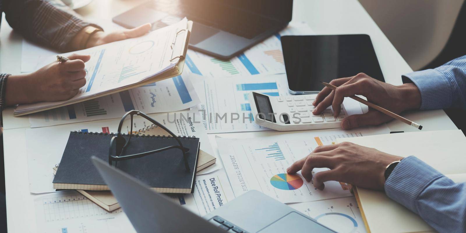 Fund managers team consultation and discuss about analysis Investment stock market by paperwork..