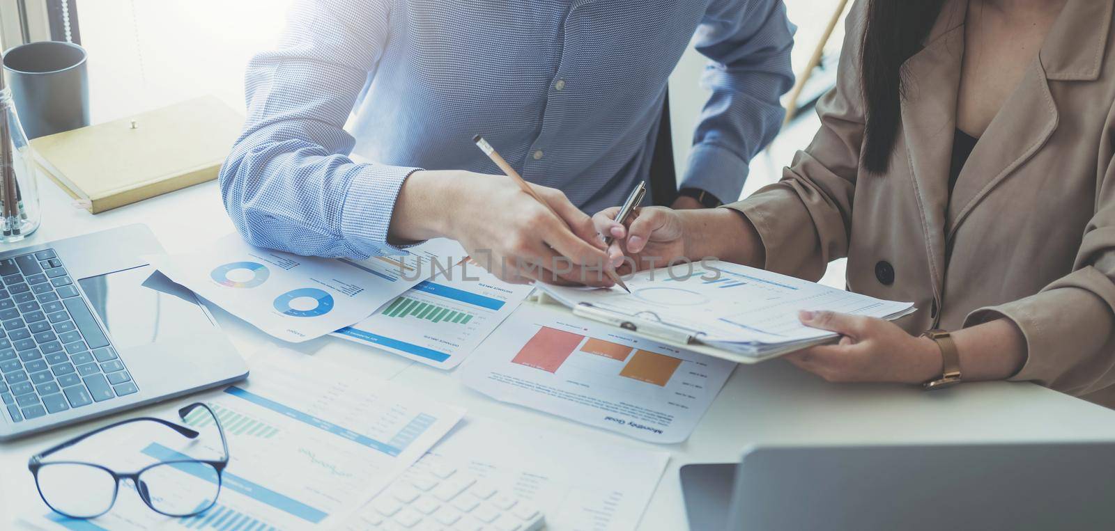 Team of business people working together in the meeting room office, teamwork background charts and graphs banner, double exposure successful teamwork,business planning concept. by wichayada