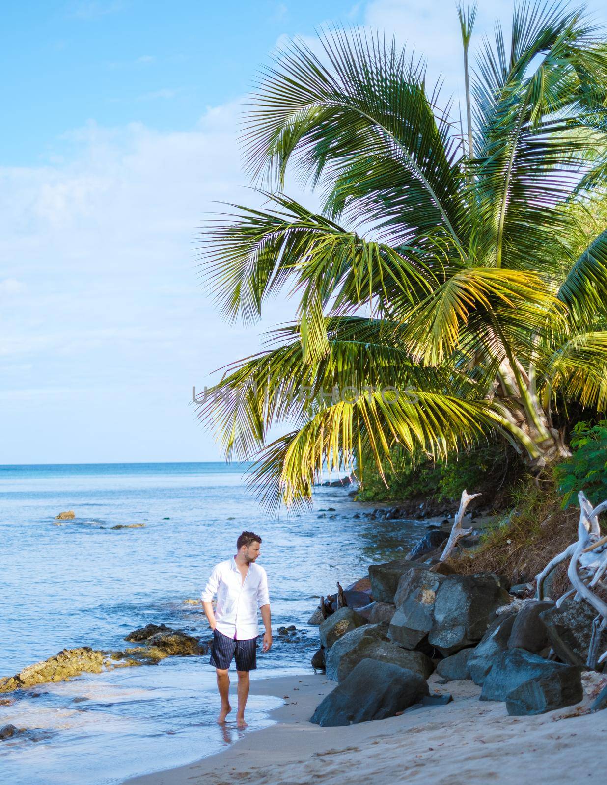 young men in swimshort on vacation Saint Lucia, luxury holiday Saint Lucia Caribbean by fokkebok