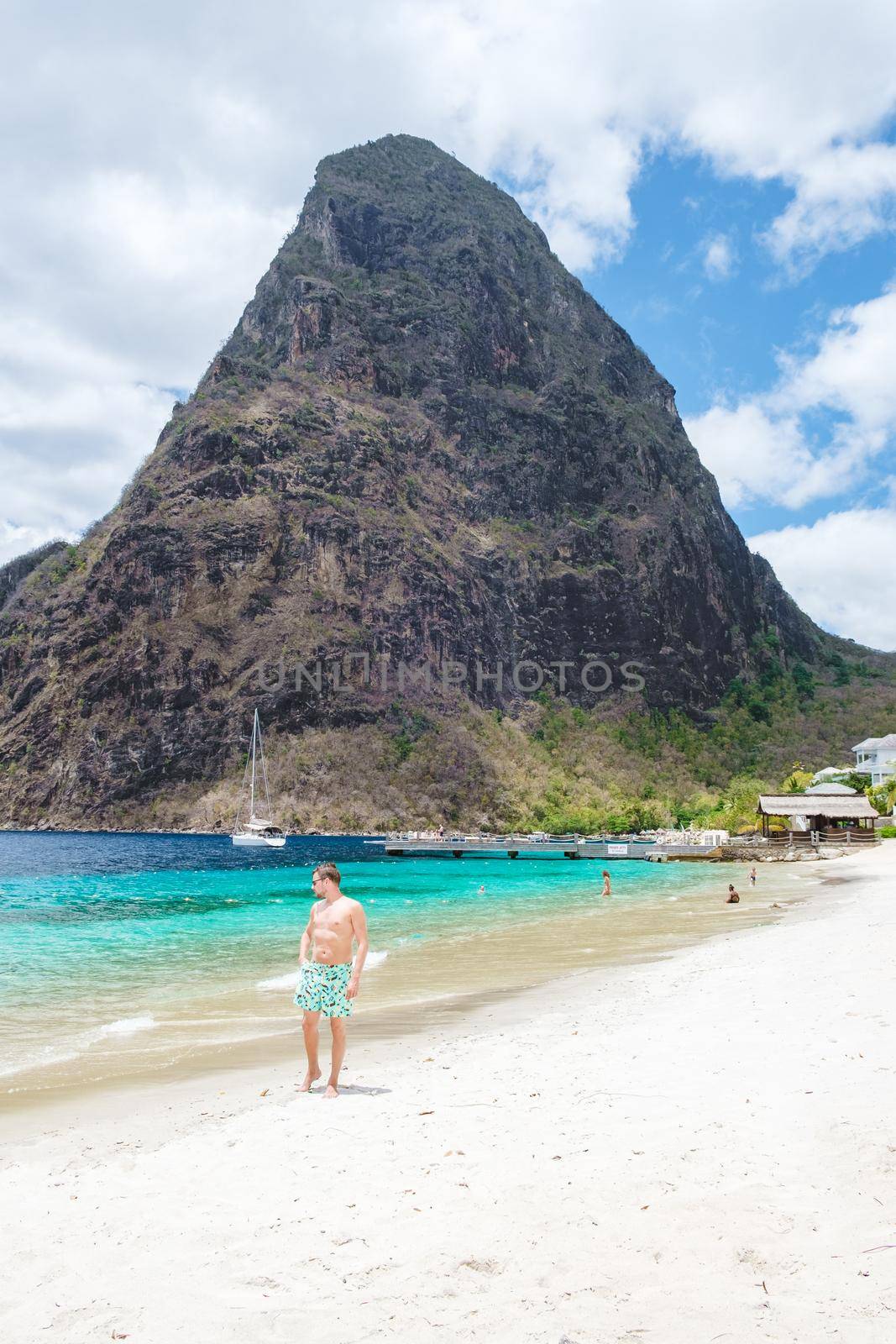 young men in a swim short on vacation in Saint Lucia, luxury holiday Saint Lucia Caribbean, men on vacation at the tropical Island of Saint Lucia Caribbean. Calabash beach St Lucia Caribbean