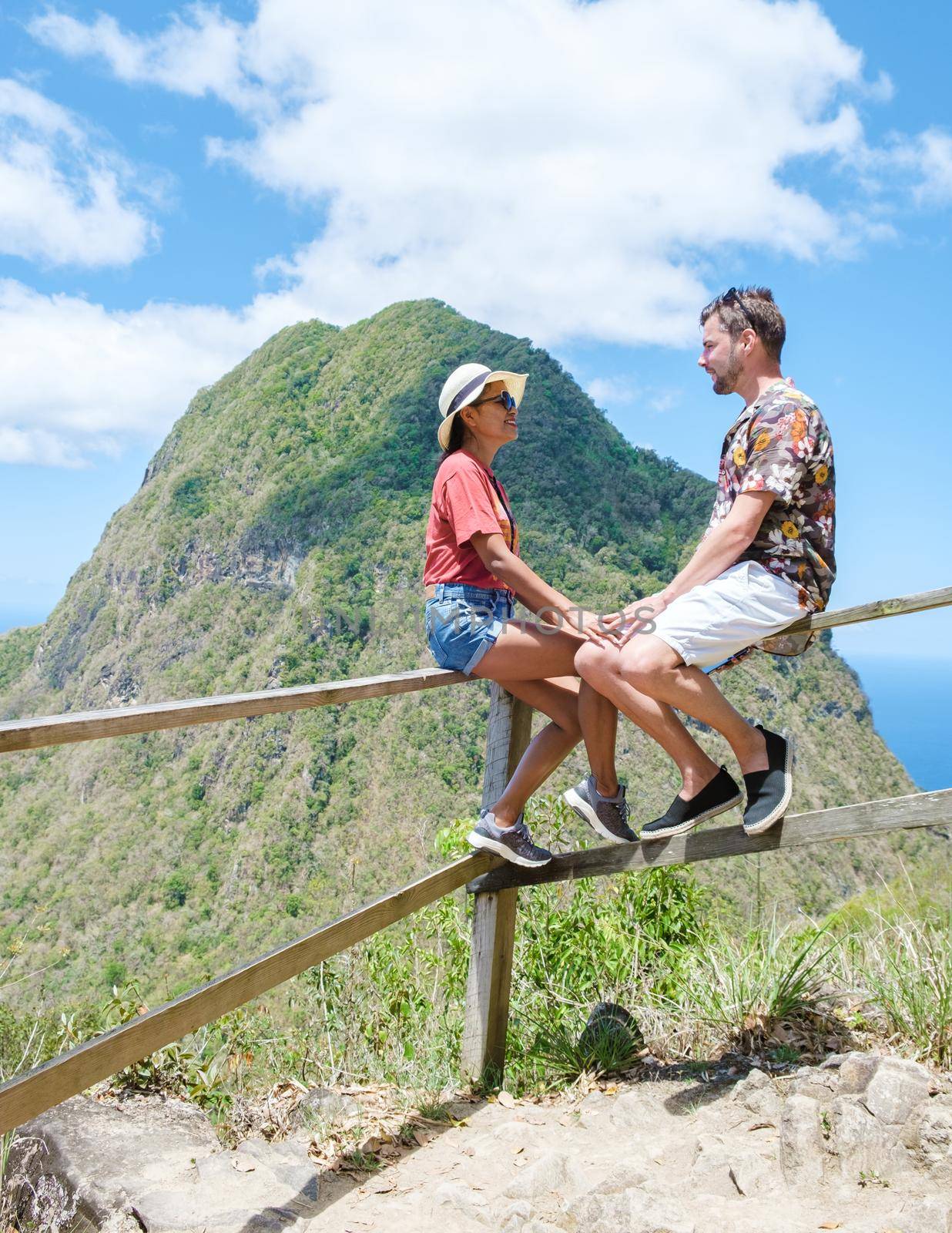 Couple hiking in Saint Lucia Caribbean, nature trail in the jungle of Saint Lucia huge Pitons by fokkebok