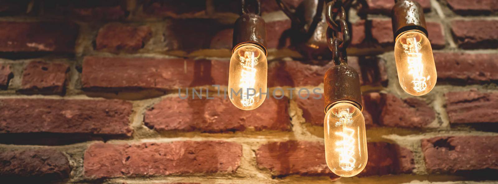 Grunge lamp on the wall. Steampunk background Lighting decor
