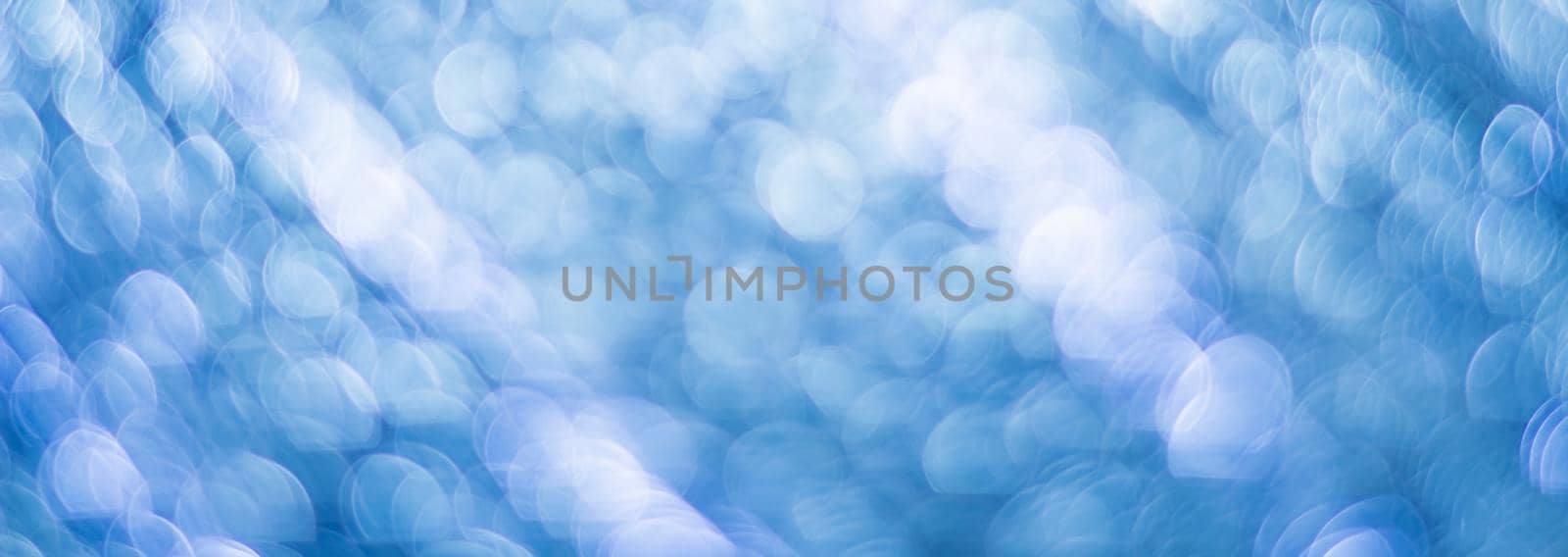 Blue abstract background with bokeh defocused lights by vikiriki