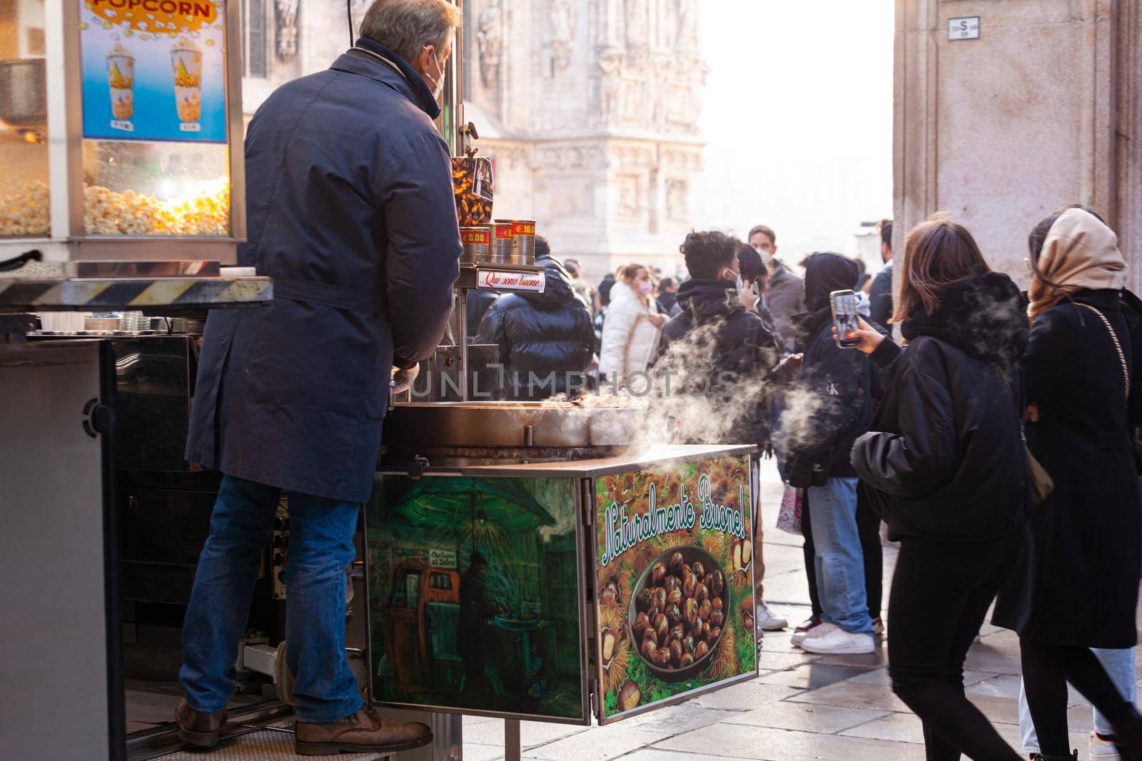 A street vendor sells freshly roasted chestnuts in Milan by bepsimage