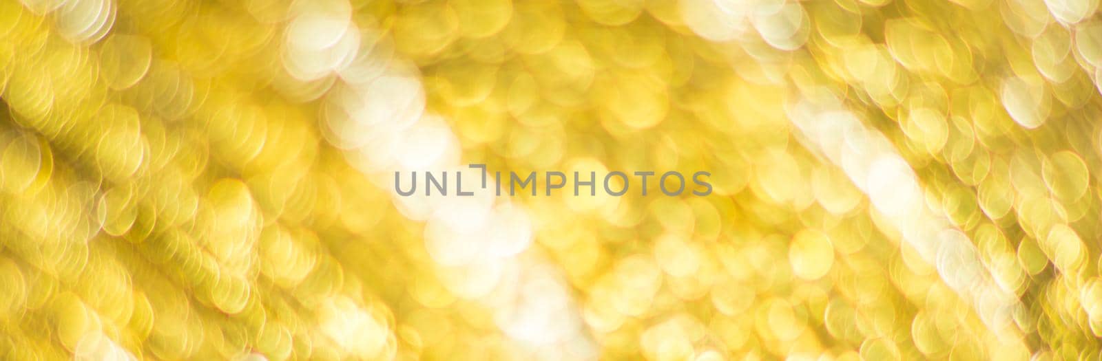 Gold abstract background with bokeh defocused lights