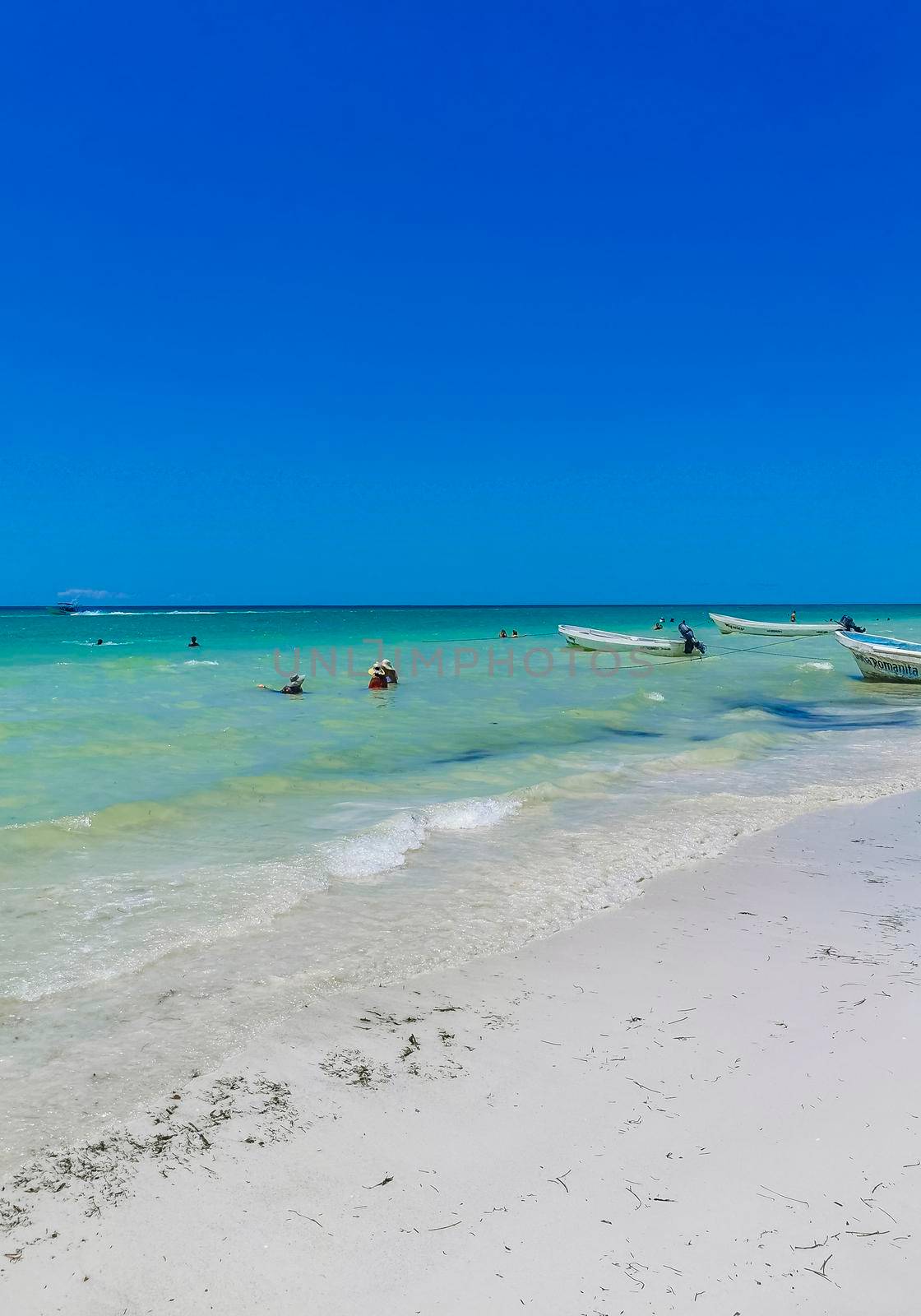 Beautiful Holbox island beach sandbank panorama turquoise water people Mexico. by Arkadij