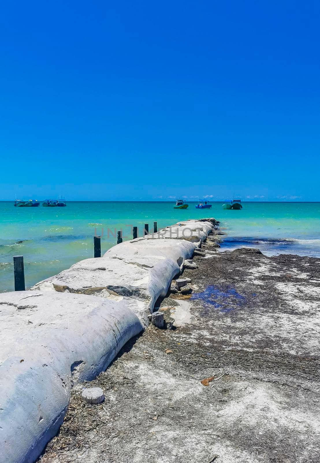 Beautiful Holbox island beach sandbank panorama turquoise water people Mexico. by Arkadij