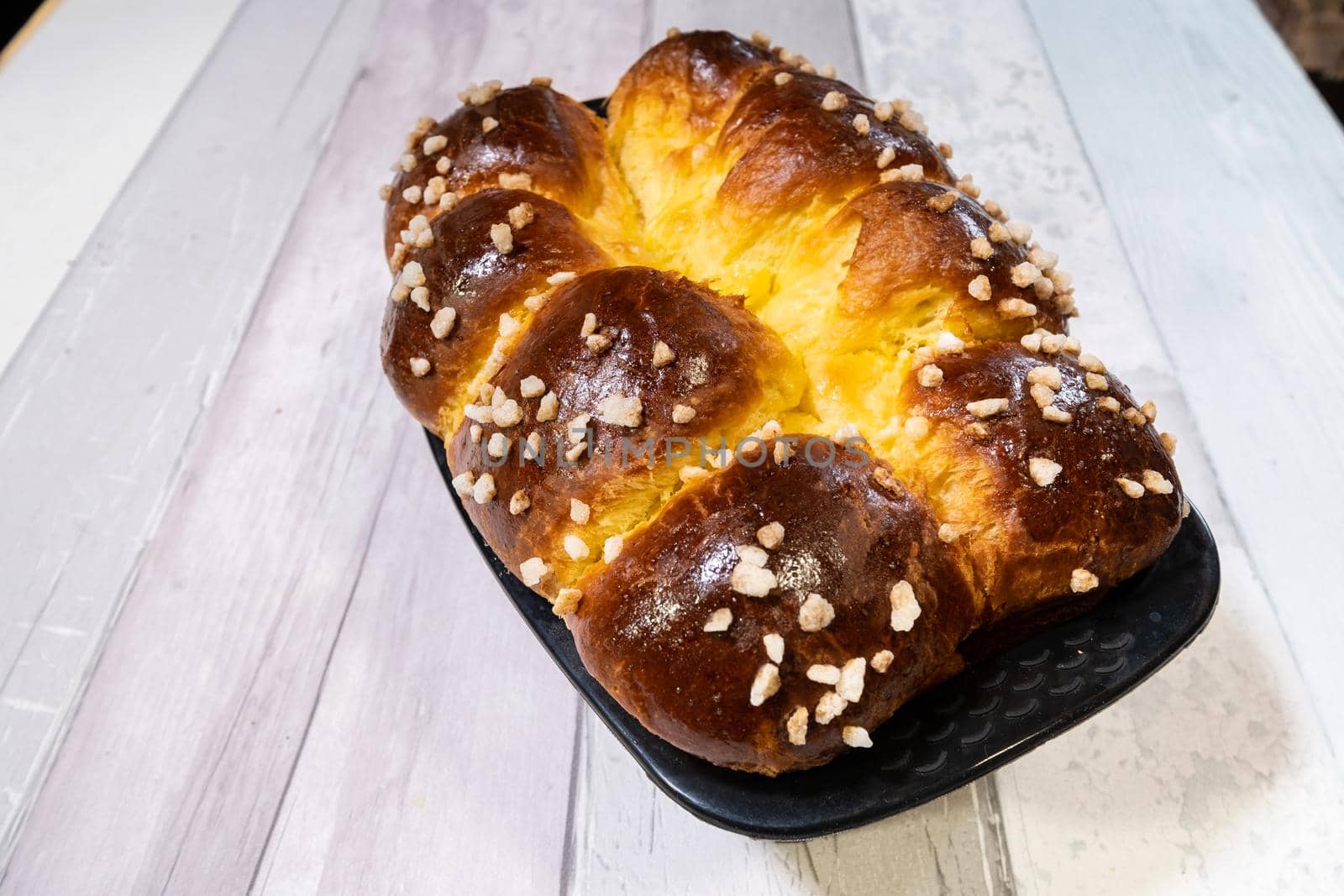 Brioche with butter and golden and crispy sugar just out of the oven