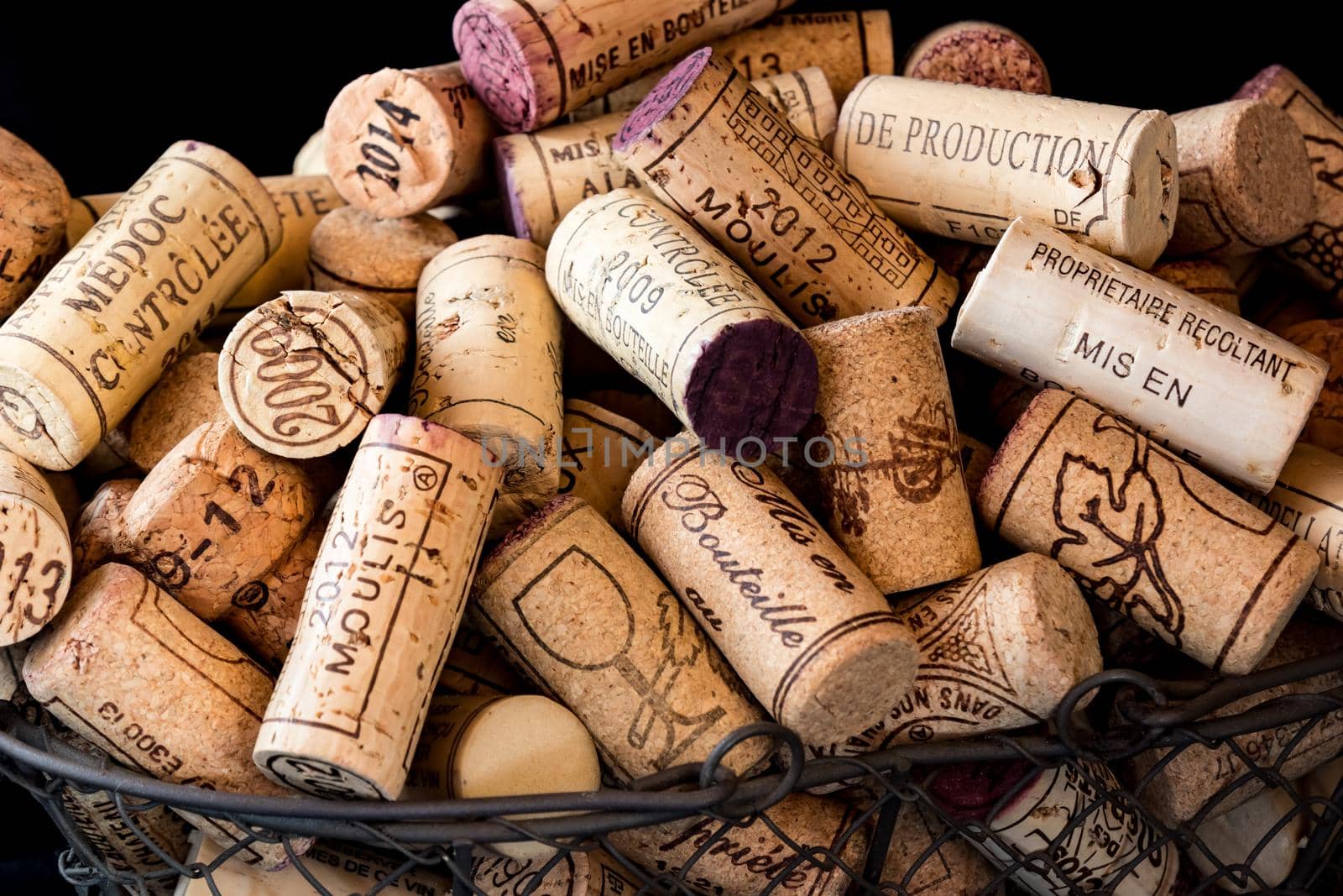 old cork stoppers of French wines in a wire basket