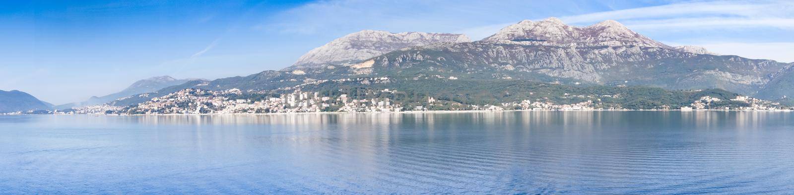 Panoramic view of Bay of Kotor from the sea surrounded by mountains in Montenegro, one of the most beautiful bay in the world.