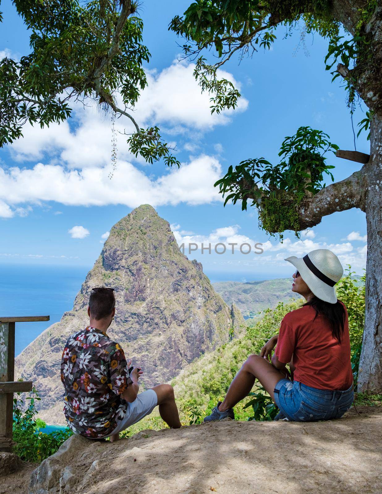 Couple hiking in Saint Lucia Caribbean, nature trail in the jungle of Saint Lucia huge Pitons by fokkebok