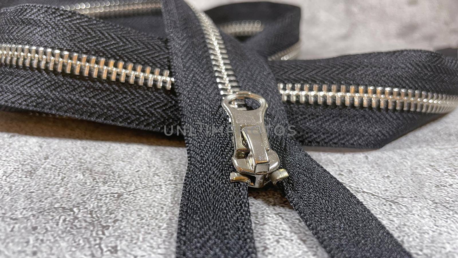 black zipper on the grey background