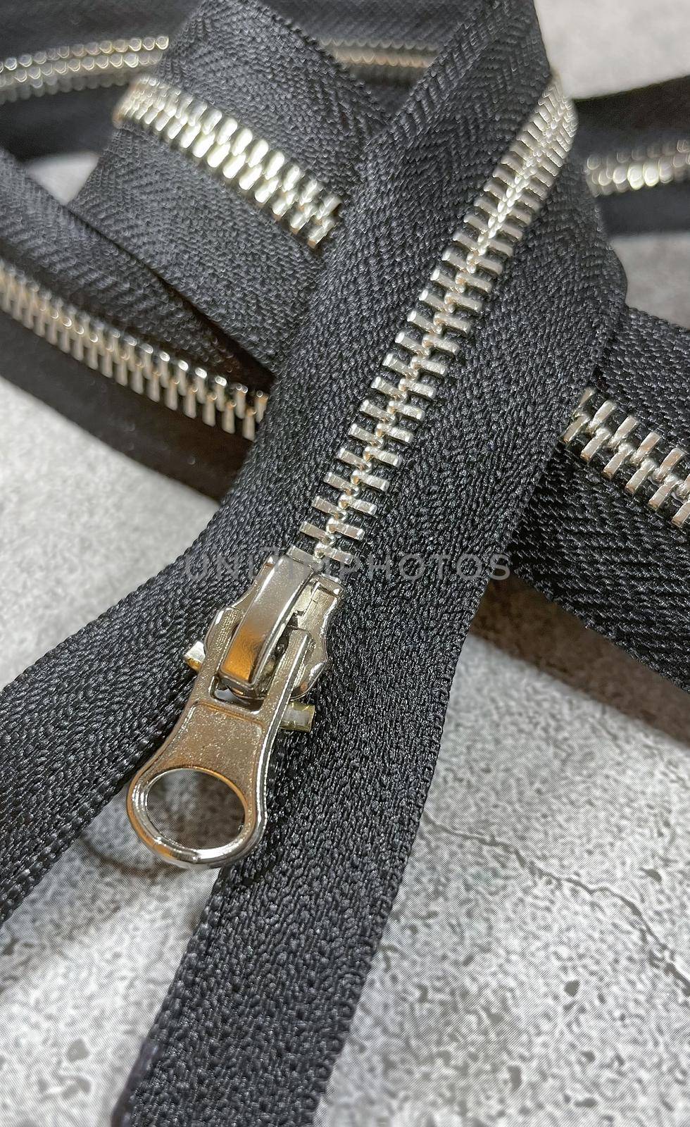 black zipper on the grey background