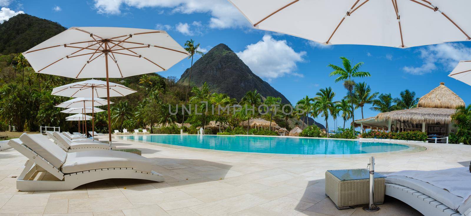 Sugar beach Saint Lucia ,white tropical beach palm trees and luxury beach chairs St Lucia Caribbean by fokkebok