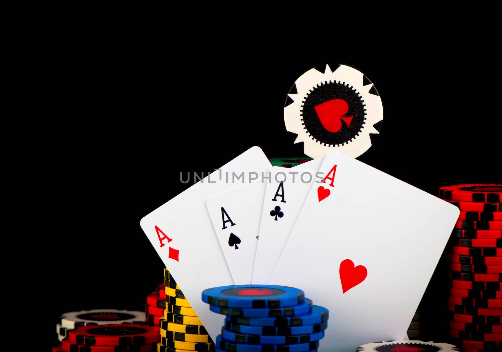 Poker Chips on a green gaming table. by aprilphoto