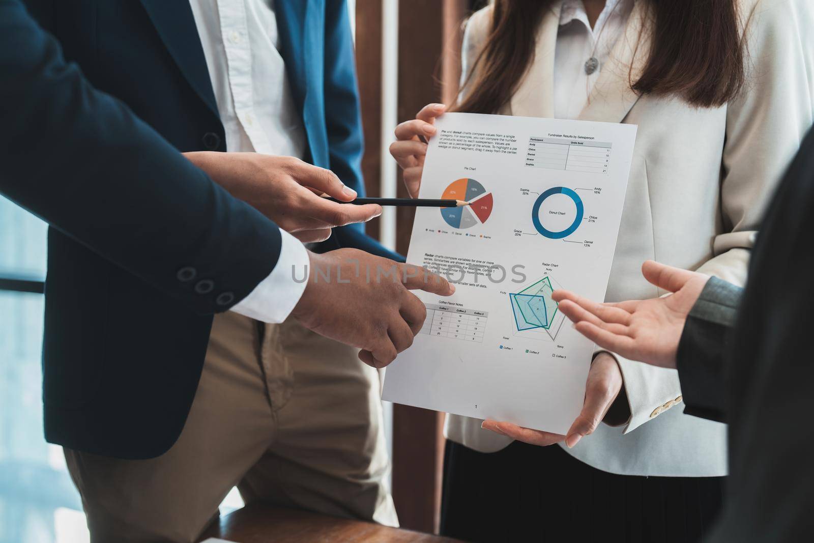 Business people are meeting for analysis data figures to plan business strategies. Business discussing concept.